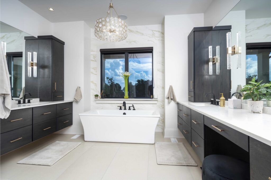 Master Bathroom With Soaking Tub And Window With Lake Views