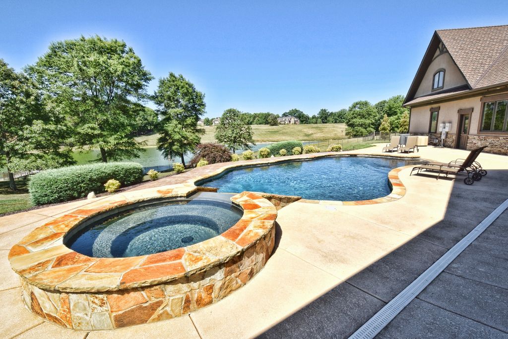 Stone Pool With Hot Tub